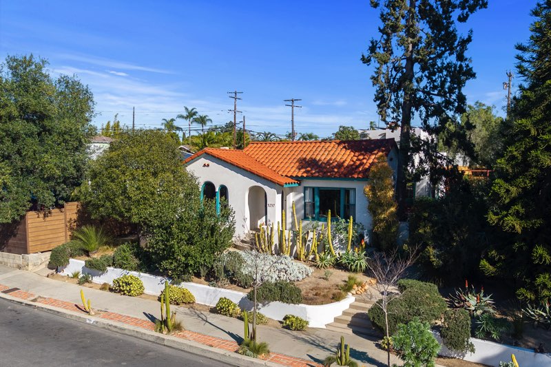 White Spanish Style Revival home in north park with red tiled roof