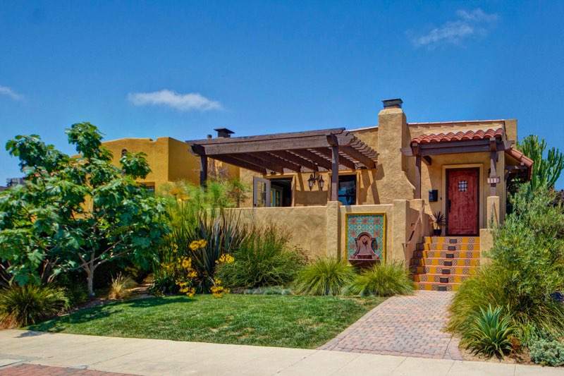Spanish Revival home in North Park San Diego with stucco exterior, clay tile roof, and colorful entry tilework